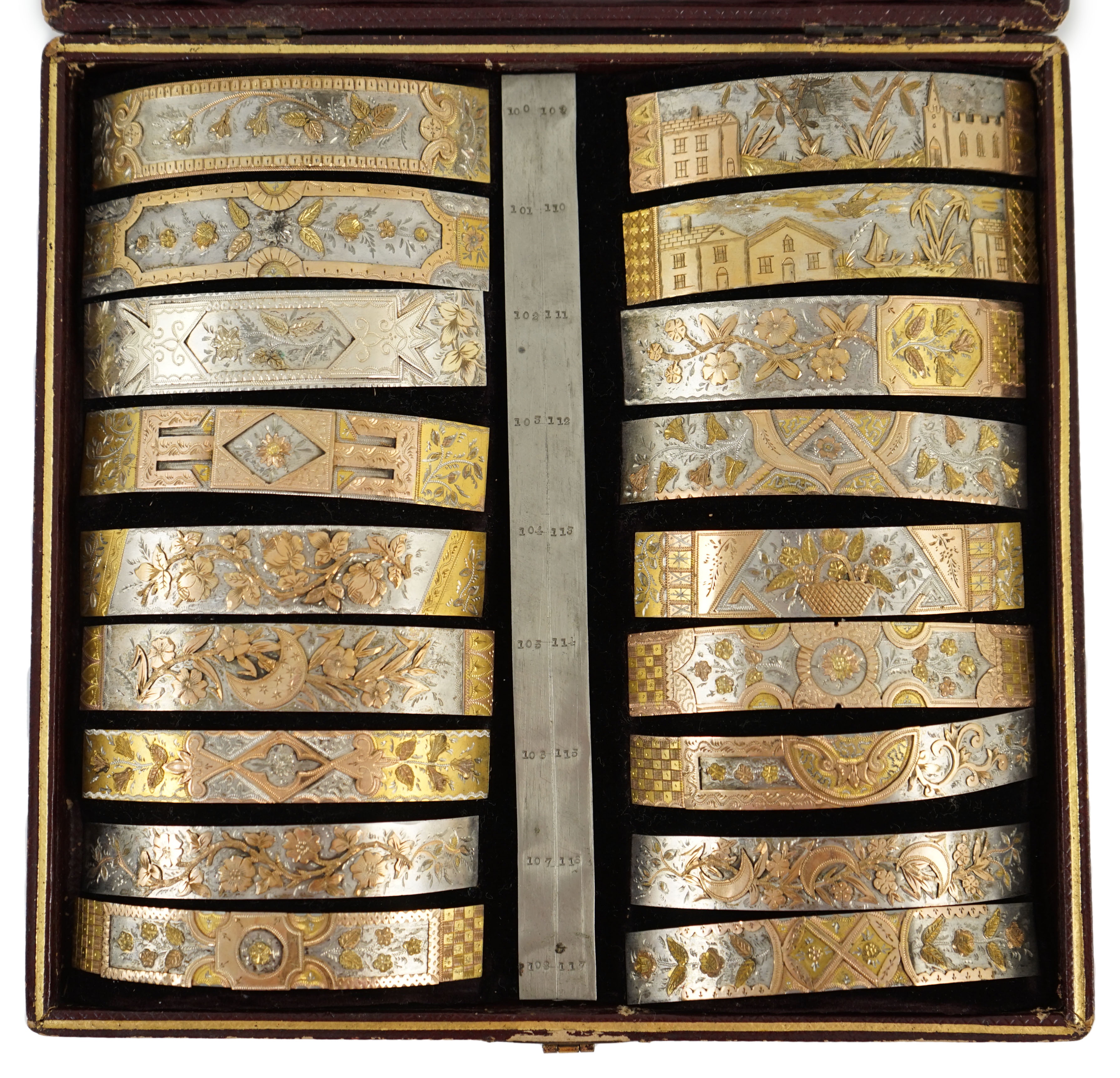 A Victorian cased travelling polychromatic metal bangle template set